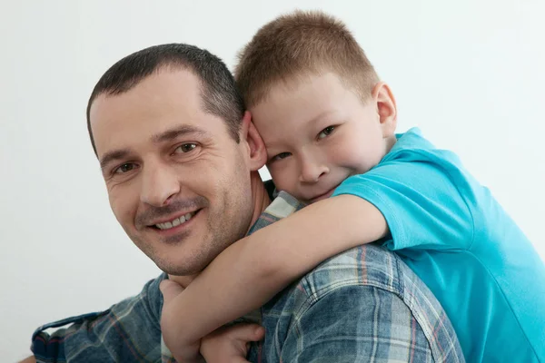 Happy father and son playing and laughing together at home. — Stock Photo, Image