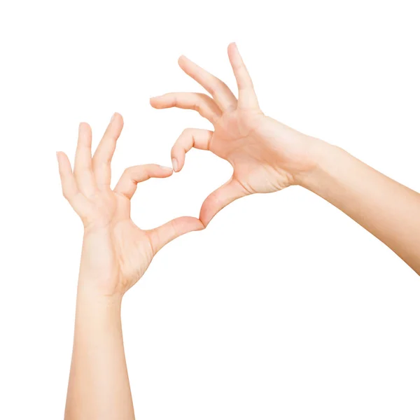 Kvinnans händer Visa hjärta form på vit bakgrund — Stockfoto
