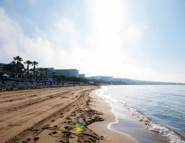 Soft Wave Of Blue Ocean On Sandy Beach. Background. Selective focus. The beach in the morning at sunrise in Ayia Napa on the island of Cyprus — Stock Photo, Image