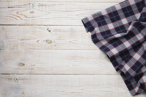 White old vintage wooden table with a checkered tablecloth. — Stock Photo, Image