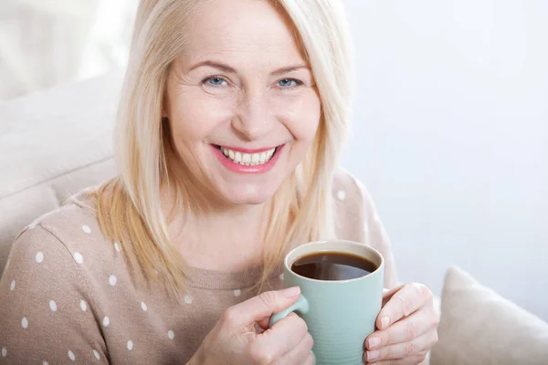 Portrait of happy blonde with mug in hands — Stok Foto