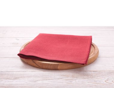 Pizza board, with napkin on wooden table isolated. Top view mockup clipart