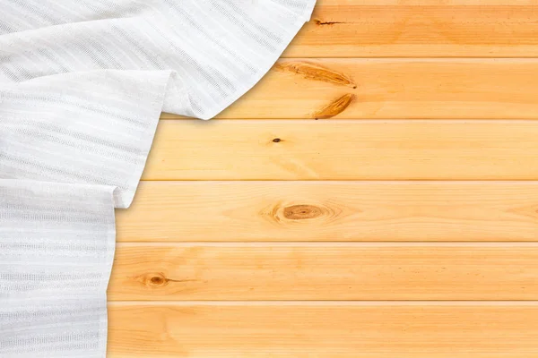 Біла настільна тканина на дерев'яному столі. Макет верхнього перегляду . — стокове фото