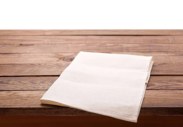 Mesa con servilleta blanca aislada en blanco . —  Fotos de Stock