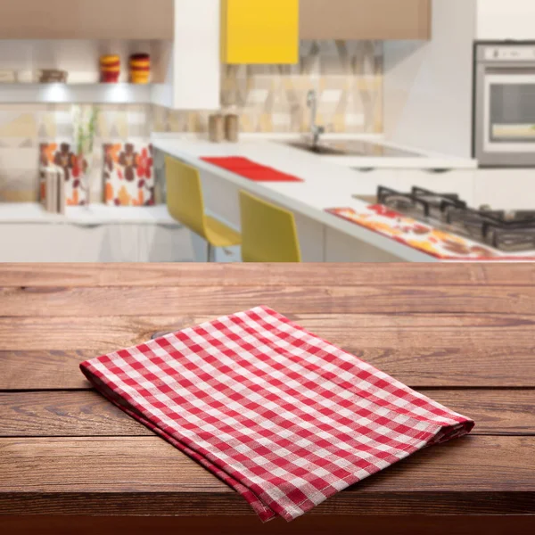 Free space on brown desk top and Red checkered tablecloth on empty wooden table. Napkin close up top view mock up for design. Kitchen rustic background. — Stock Photo, Image