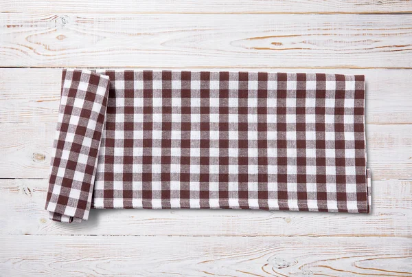 Napkin. Kitchen towel or table cloth on white wooden scene. Mock up for design. Top view. — Stock Photo, Image