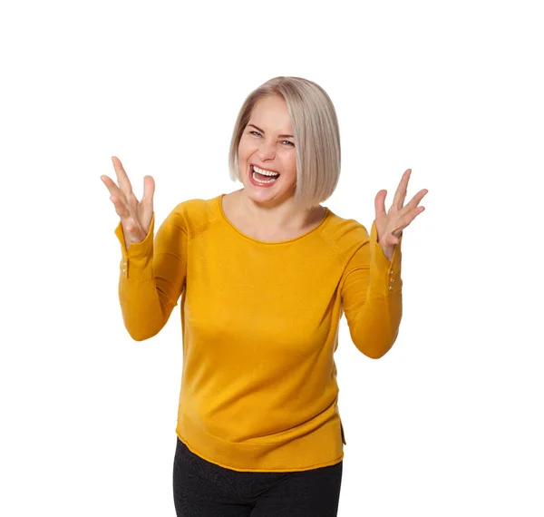 Middle aged blonde emotionally posing in a studio. Happy woman in yellow bright sweater on white background — Stock Photo, Image