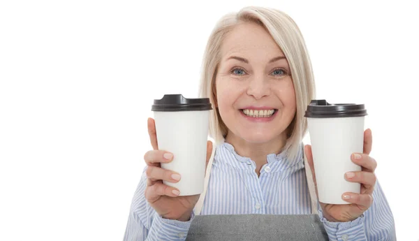 Part-time job coffee break relax leisure pause concept. Friendly pleasant woman barista giving two big latte isolated on gray background copy-space — Stock Photo, Image