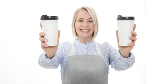 Part-time job coffee break relax leisure pause concept. Friendly pleasant woman barista giving two big latte isolated on gray background copy-space — Stock Photo, Image