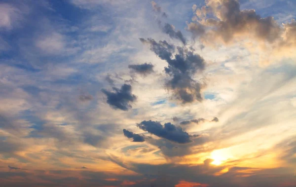 Amazing mix of colors in the sky and placing clouds during sunset. Sky background. 로열티 프리 스톡 이미지