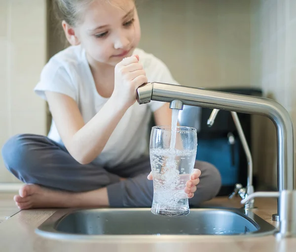 Little Girl Open Water Tap Her Hand Holding Transparent Glass — Stock Photo, Image