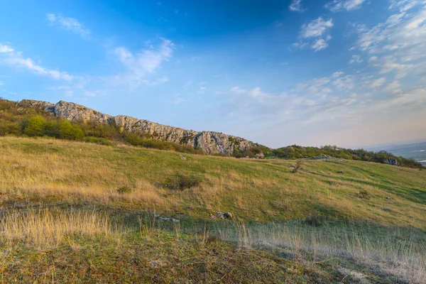 countryside landscape with mountains in spring season