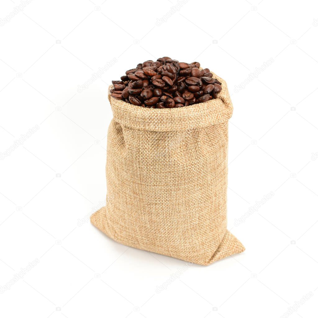 Coffee beans. Hard roasted coffee beans in jute burlap sack, isolated on white background.