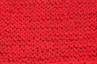 El örgüsü kırmızı arka plan. Geçen yüzyılın ortalarında eski bir kırsal el örgüsü deseni. Kırmızı vintage yün arka plan ve dokuyu kapat