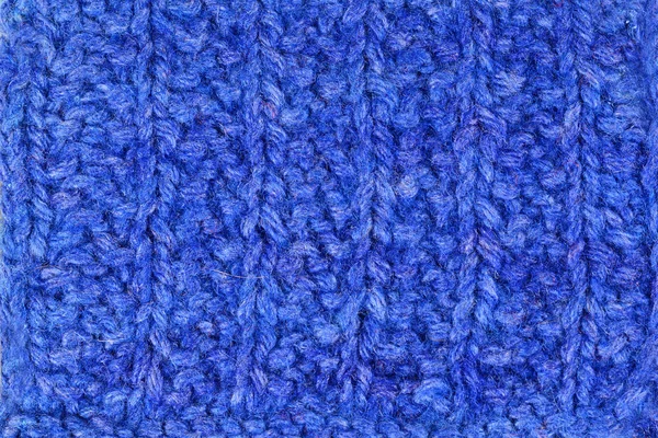 Tricot à la main fond bleu. Modèle vintage de tricot rustique à la main du milieu du siècle dernier. Bleu laine vintage gros plan fond et texture — Photo