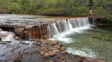 Fruit Bat Falls is in the remote area of North Queensland clipart