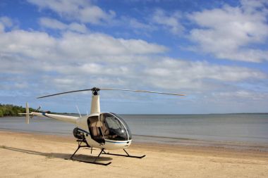Weipa helicopter on the beach clipart