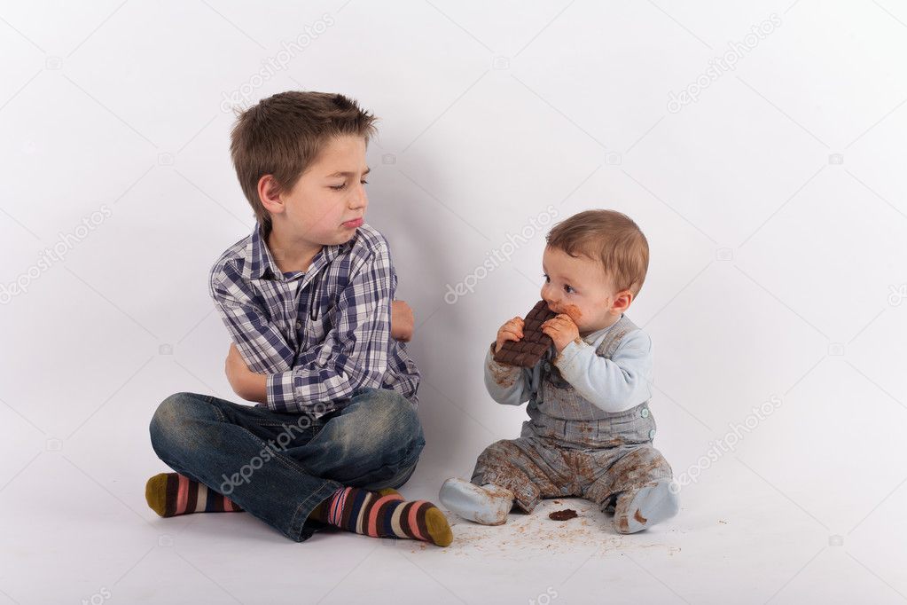 Siblings conflict because of a plate of chocolate
