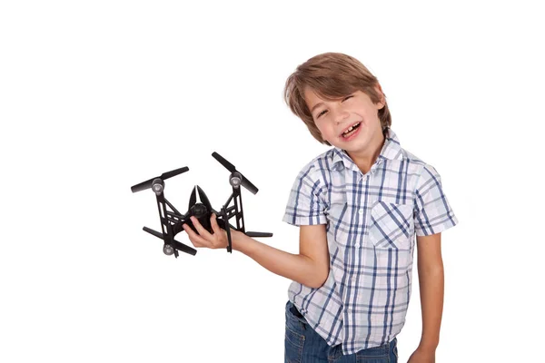 Menino alegre brincando com um drone . — Fotografia de Stock