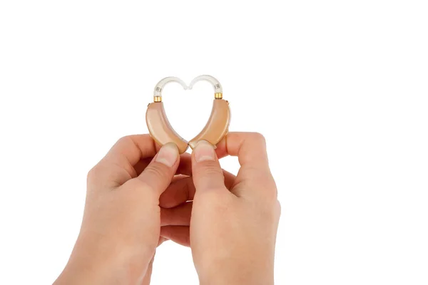 Tvar srdce od naslouchátka izolované na bílém — Stock fotografie