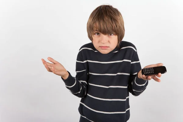 Young boy disappointed because he has a basic mobile phone only — Stock Photo, Image