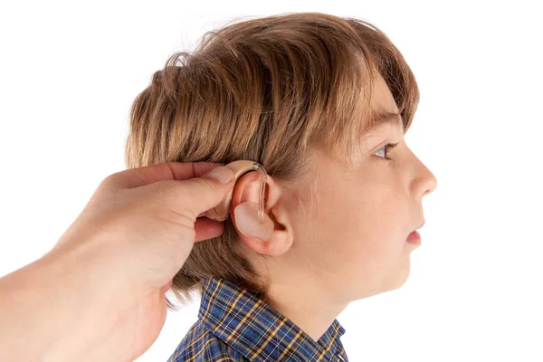 Audiologist Inserting Hearing Aid Young Boy Patient Ear Isolated White — Stock Photo, Image