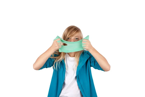 Cute girl holding green slime looks like gunk in front of her fa — Stock Photo, Image