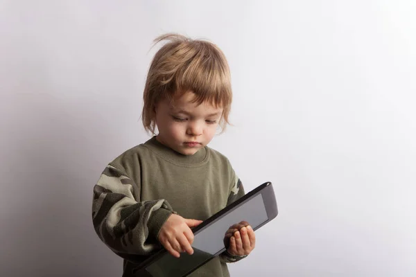 Baby boy with a tablet pc device — Stock Photo, Image