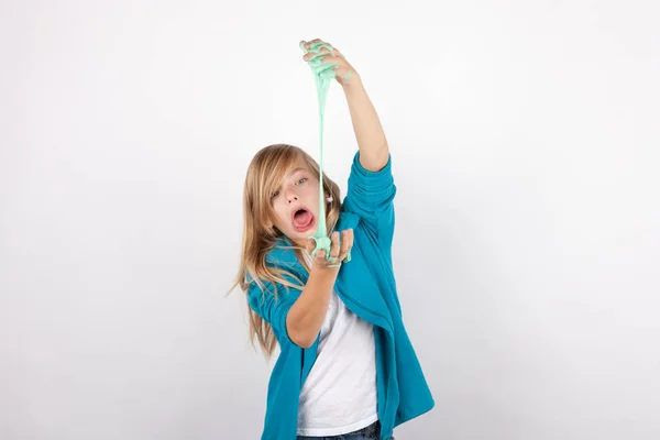 Funny girl fooling around with slime — Stock Photo, Image