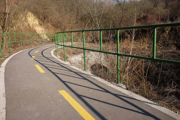 Bicycle road with green handrails — Stock Photo, Image