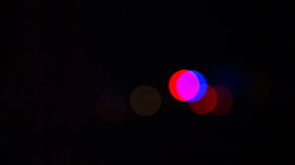 De felle kleur van de bokeh in de duisternis — Stockfoto