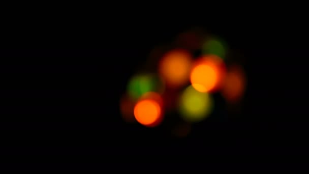 Multicolored soft bokeh on a black background — Stock Video