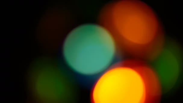 Multicolored soft bokeh on a black background — Stock Video