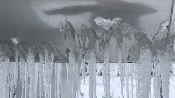 Icicles on a large metal tube — Stock Video
