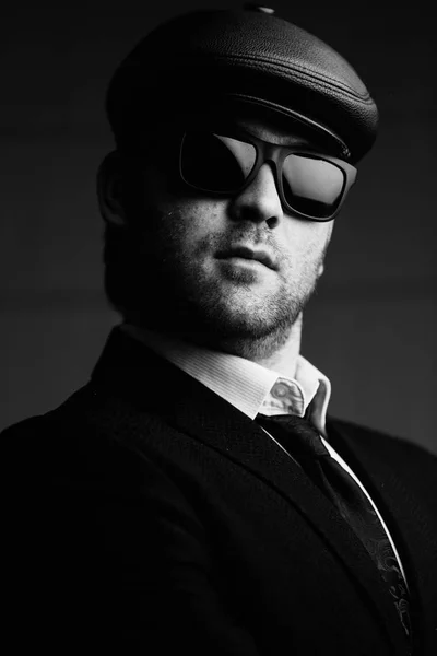 stock image man in sunglasses and a leather cap