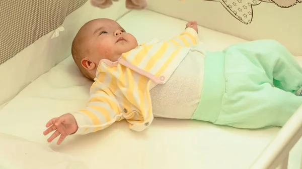 Little baby is resting in his crib — Stock Photo, Image