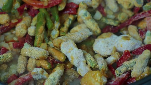 Chakhokhbili with beans frozen ready product cooking in a pan closeup — Stock Video