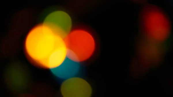 Multicolored soft bokeh on a black background — Stock Photo, Image