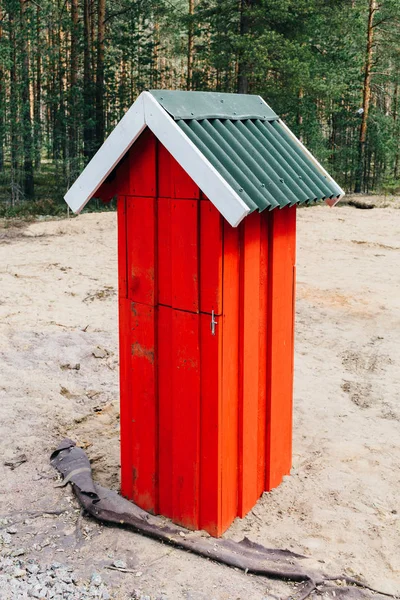 Red wooden mailbox in the village. — Stock Photo, Image