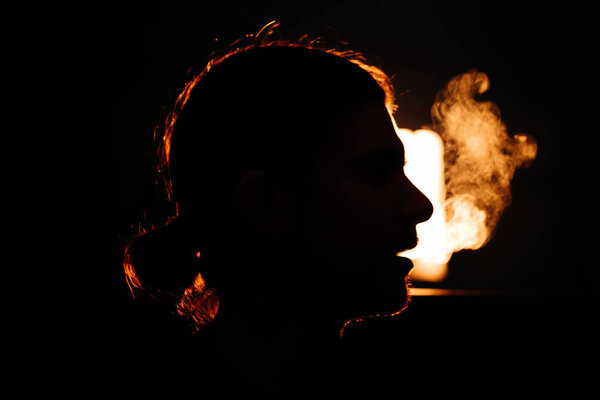 mans head in the smoke