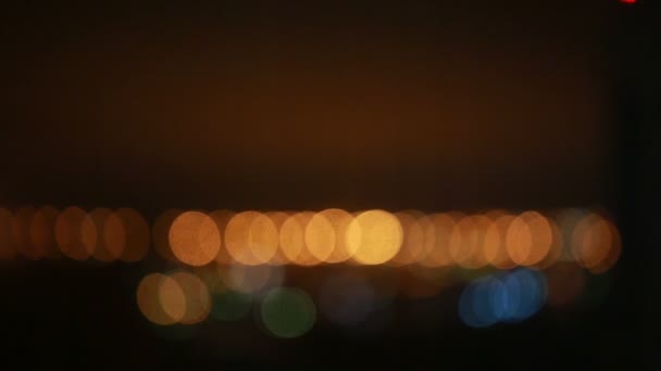 Narancs és kék bokeh éjjel. — Stock videók