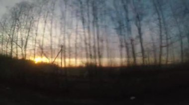 Araba penceresinde günbatımı