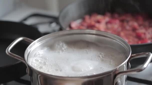 Boiling water in a saucepan — Stock Video