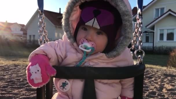 Little child on a swing In slow motion — Stock Video