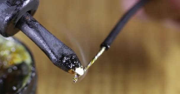 Soldering iron in rosin close-up — Stock Video