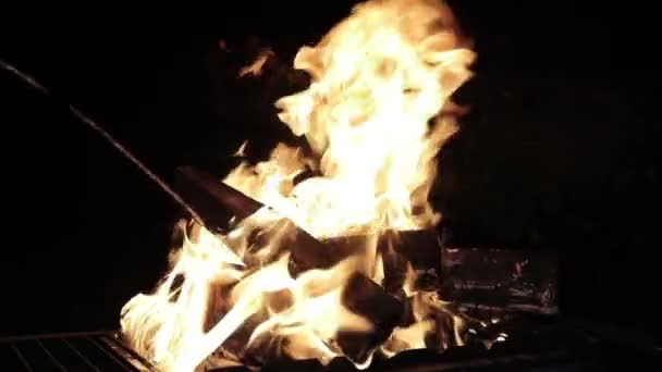 Fuel pouring into the fire in slow motion — Stock Video