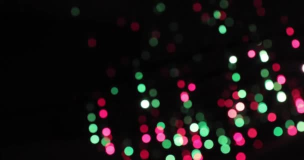 Bokeh-Hintergrund. Blinkende Girlande mehrfarbig abstrakt verschwommener Hintergrund — Stockvideo