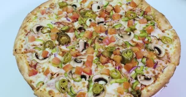 Delicious and appetizing pizza is spinning — Stock Video