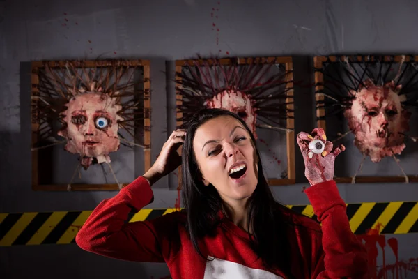 Strange woman holding eyeball in wrinkled hand — Stock Photo, Image