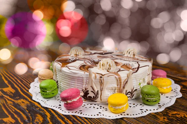 Cake with chocolate ornaments on colorful brighting background — Stock Photo, Image